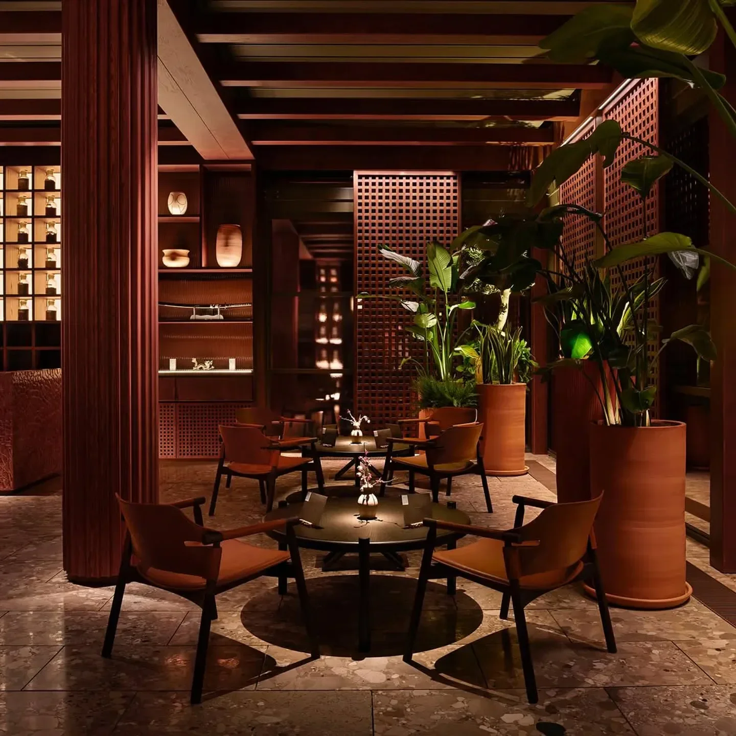 Cozy seating area at TURK FATIH TUTAK restaurant in Istanbul, with wood and plant details.