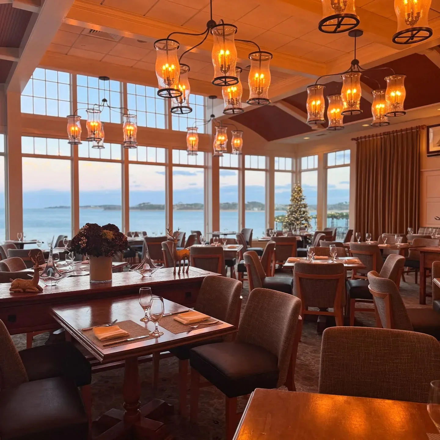 Interior of Twenty-Eight Atlantic restaurant in Cape Cod, with ocean views and warm lighting.
