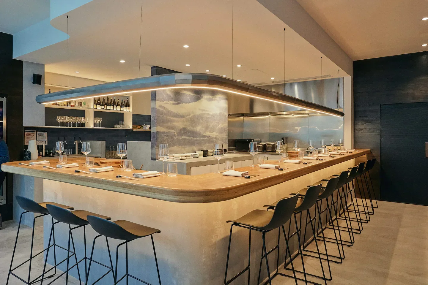 Stylish bar seating at UMINONO restaurant in Melbourne, with ambient lighting and minimalist design