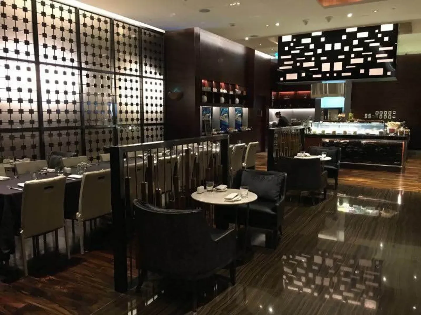 Elegant dining area at Urban Kitchen restaurant in Macau, showcasing interior design and seating.