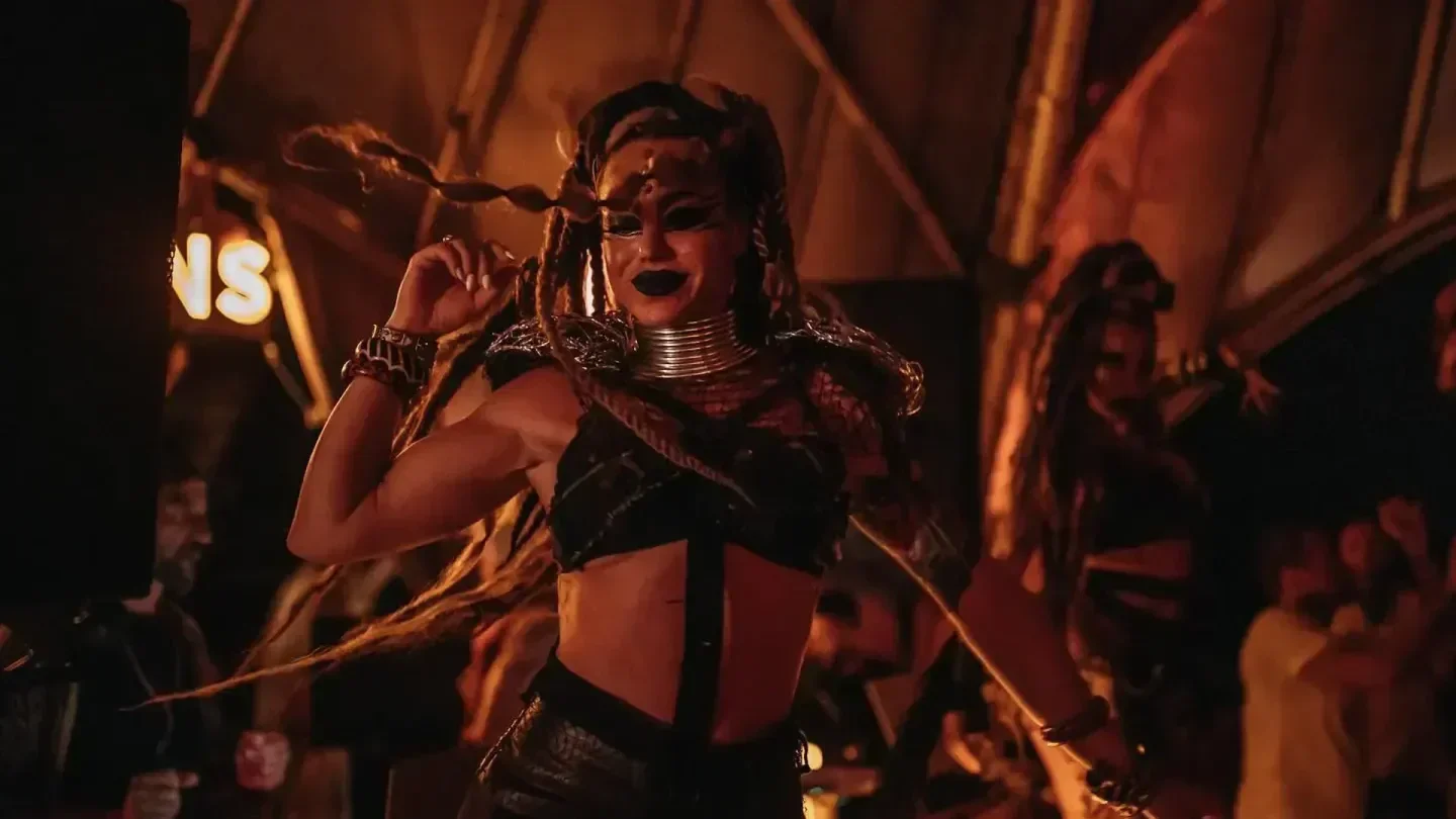 Energetic dancer performing at Vagalume beach club in Tulum, Mexico, vibrant nightlife.