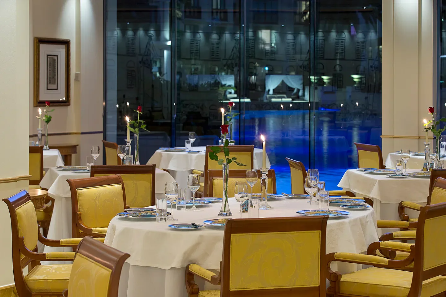 Vanitas Restaurant in Gold Coast: Elegant dining with candlelit tables and pool view.