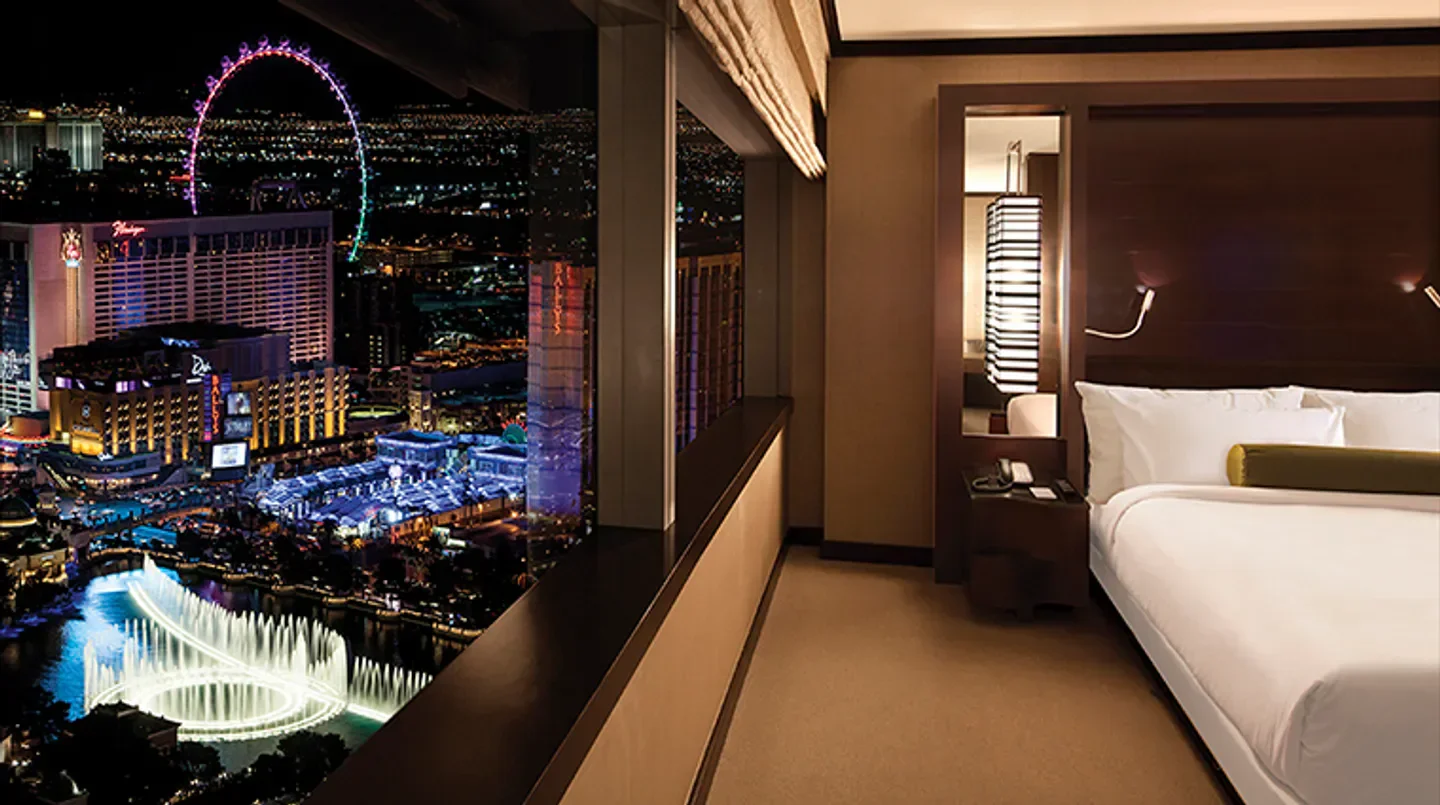 Night view from Vdara Hotel & Spa in Las Vegas, overlooking city lights and fountains.