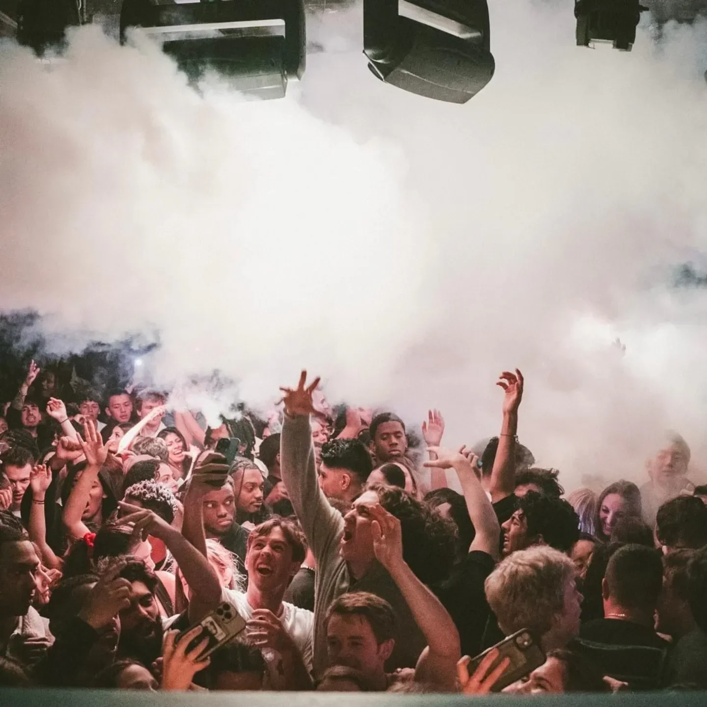 Energetic crowd at Venue nightclub in Boston, enjoying the party and fog
