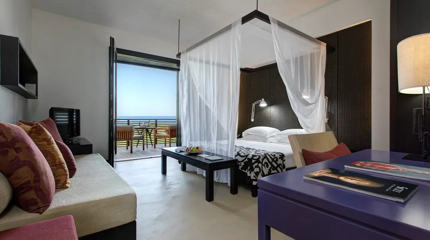 Stylish bedroom at Verdura Resort, a Rocco Forte Hotel in Sciacca, with ocean view.