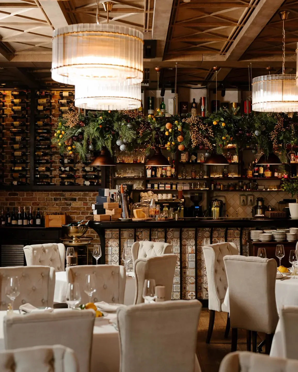 Elegant dining area at Vero Vero restaurant in Kyiv with wine and decor.