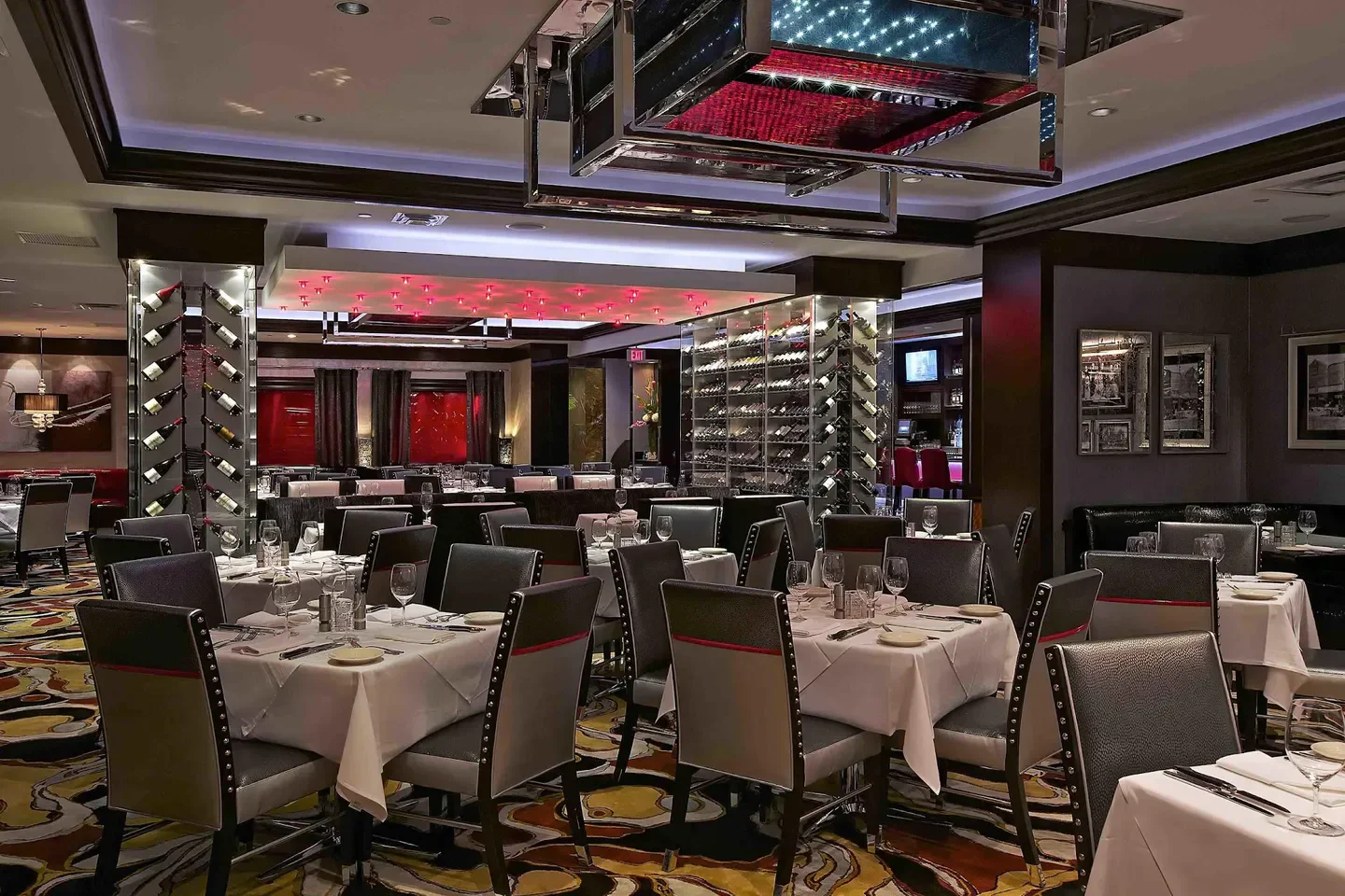 Interior of Vic & Anthony's Steakhouse - Atlantic City, featuring elegant dining and wine display.