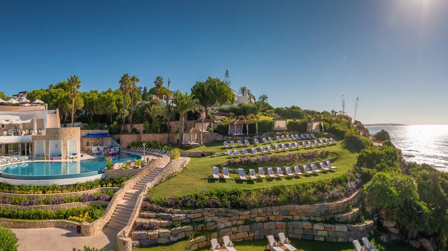 Luxury outdoor pool and sunbeds at Vila Vita Parc in Porto, Portugal.