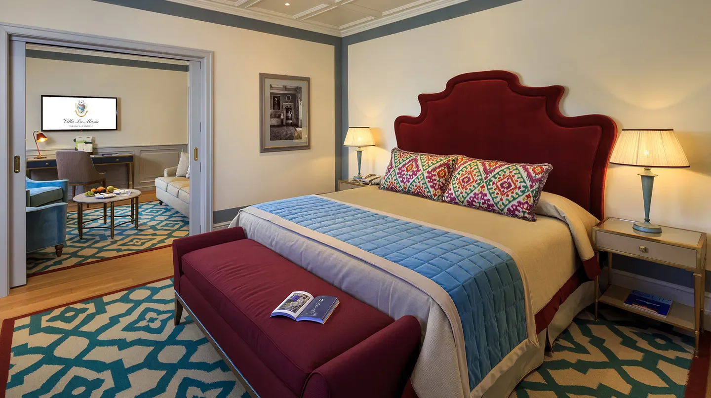 Elegant bedroom at Villa La Massa hotel in Florence, featuring luxurious decor.