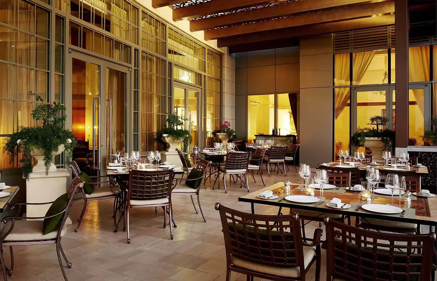 Outdoor dining at Villa Toscana restaurant in Abu Dhabi with elegant setting and tables