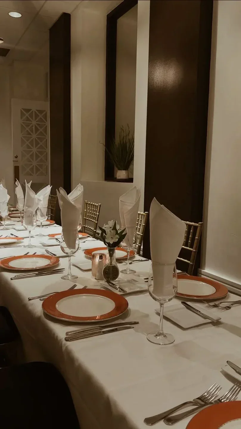 Elegant dining table at Vincenzo’s Restaurant in Louisville, set for a special occasion.