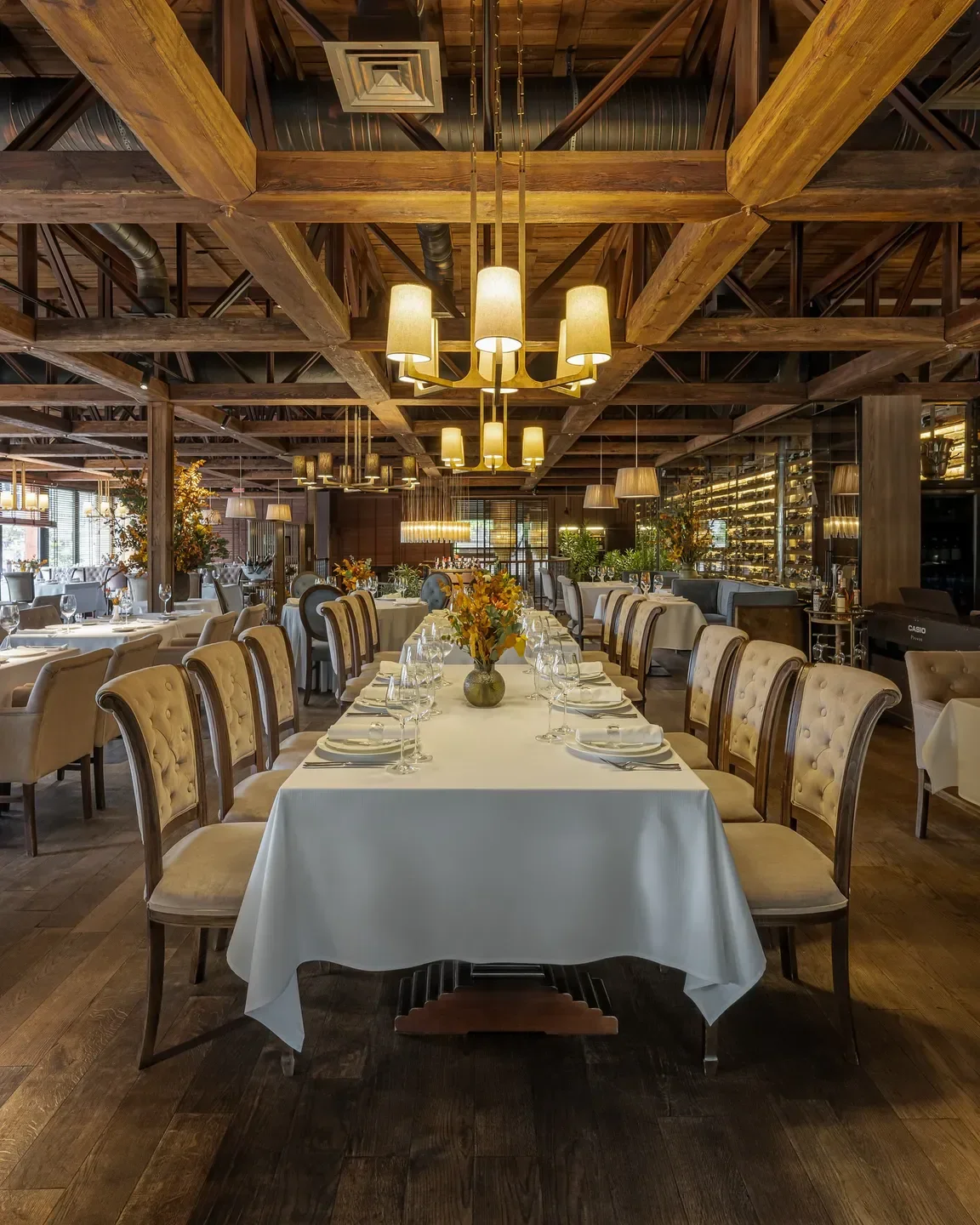 Elegant dining at VINO e CUCINA restaurant in Kyiv, featuring beautiful decor and lighting.