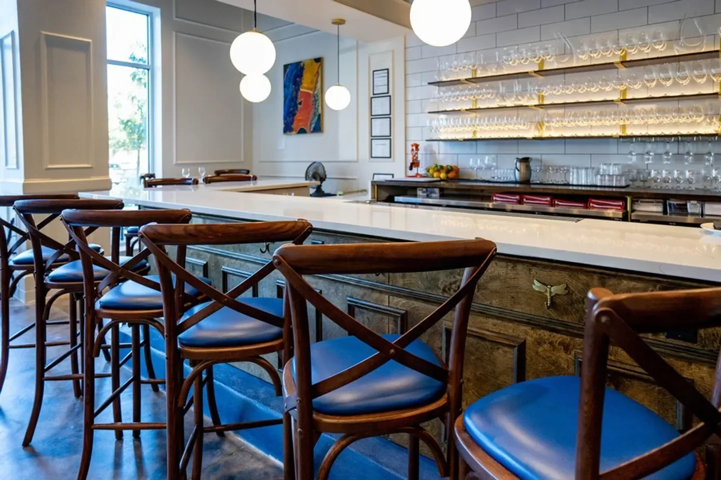 Interior view of Vintage '78 Wine Bar in Kansas City, with bar stools and decor.