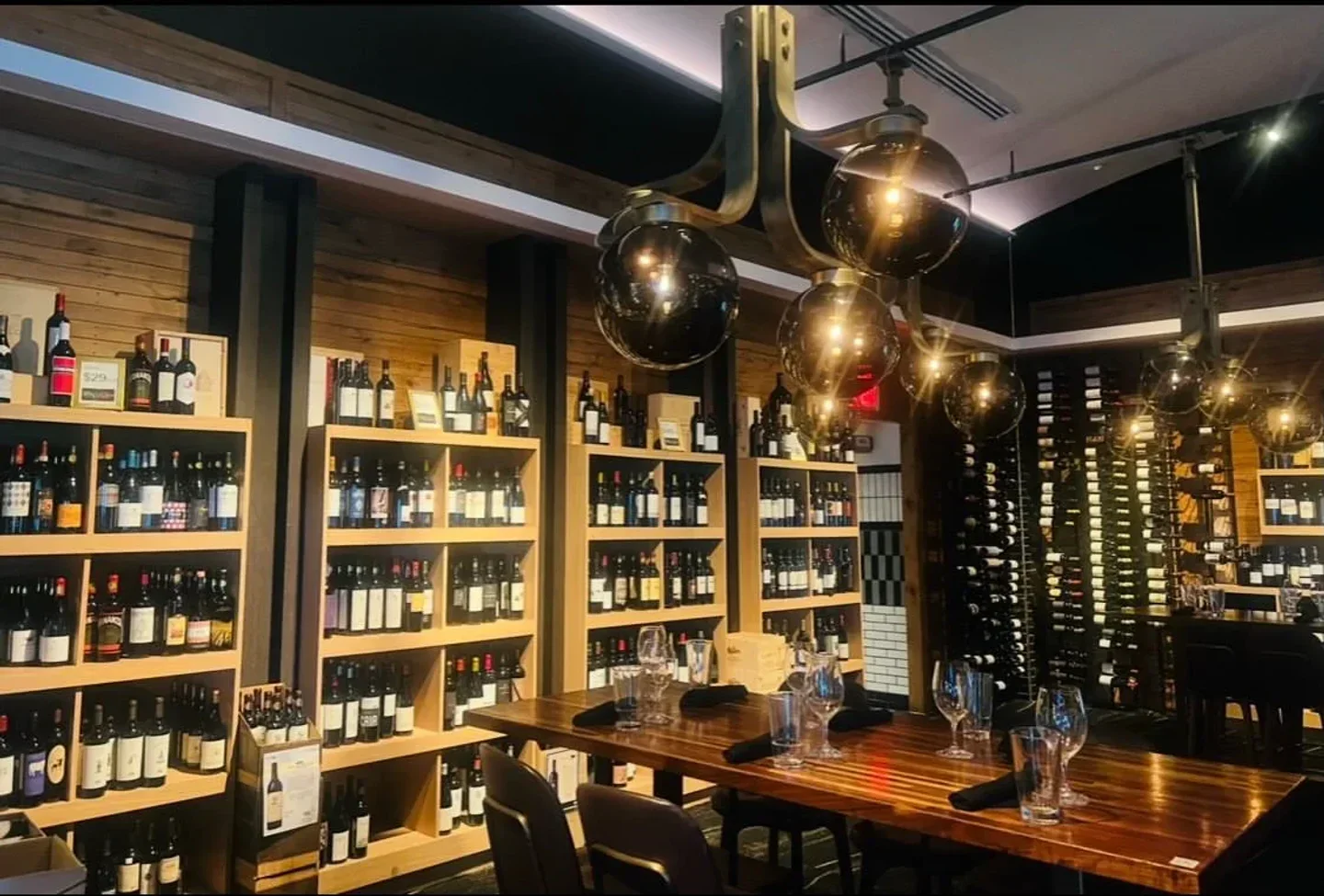 Interior of Vin'us restaurant in San Juan showcasing wine selection and dining area