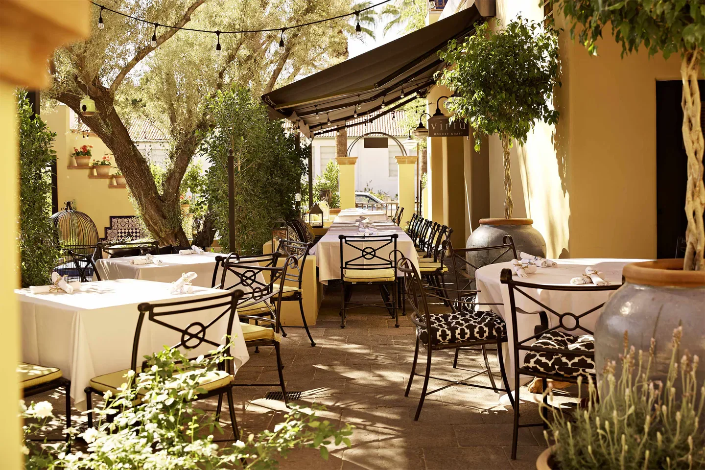 Outdoor patio at Virtu Honest Craft in Phoenix, with tables set for dining