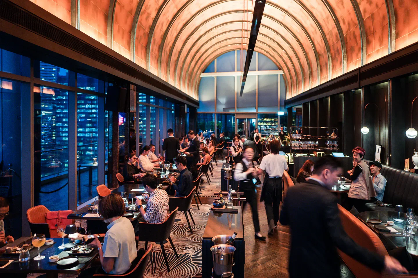 Dining at VUE Restaurant in Singapore, offering stunning city views and a vibrant atmosphere.