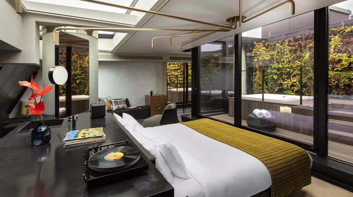 Stylish hotel suite at W Amsterdam with a record player and jacuzzi