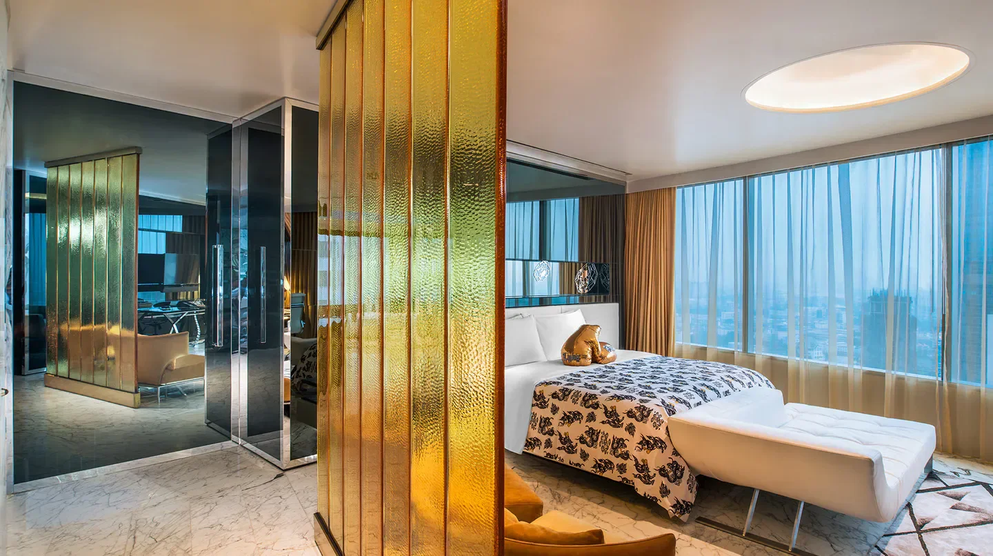 Stylish hotel suite at W Bangkok with a modern interior, featuring views of Bangkok.