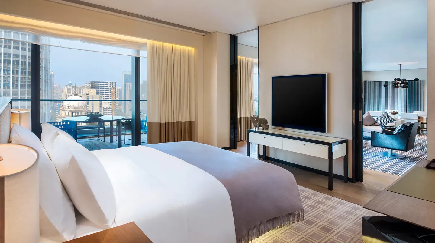 Modern bedroom in W Guangzhou hotel with city views in Guangzhou, China.
