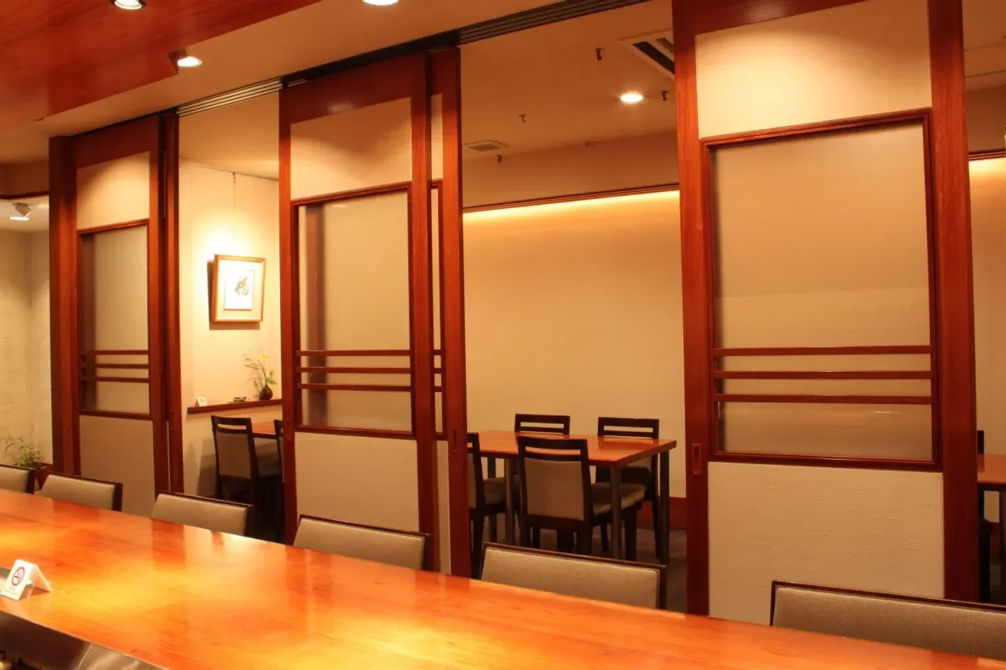 Elegant dining space at Wa Yamamura restaurant in Nara, showcasing traditional Japanese design.