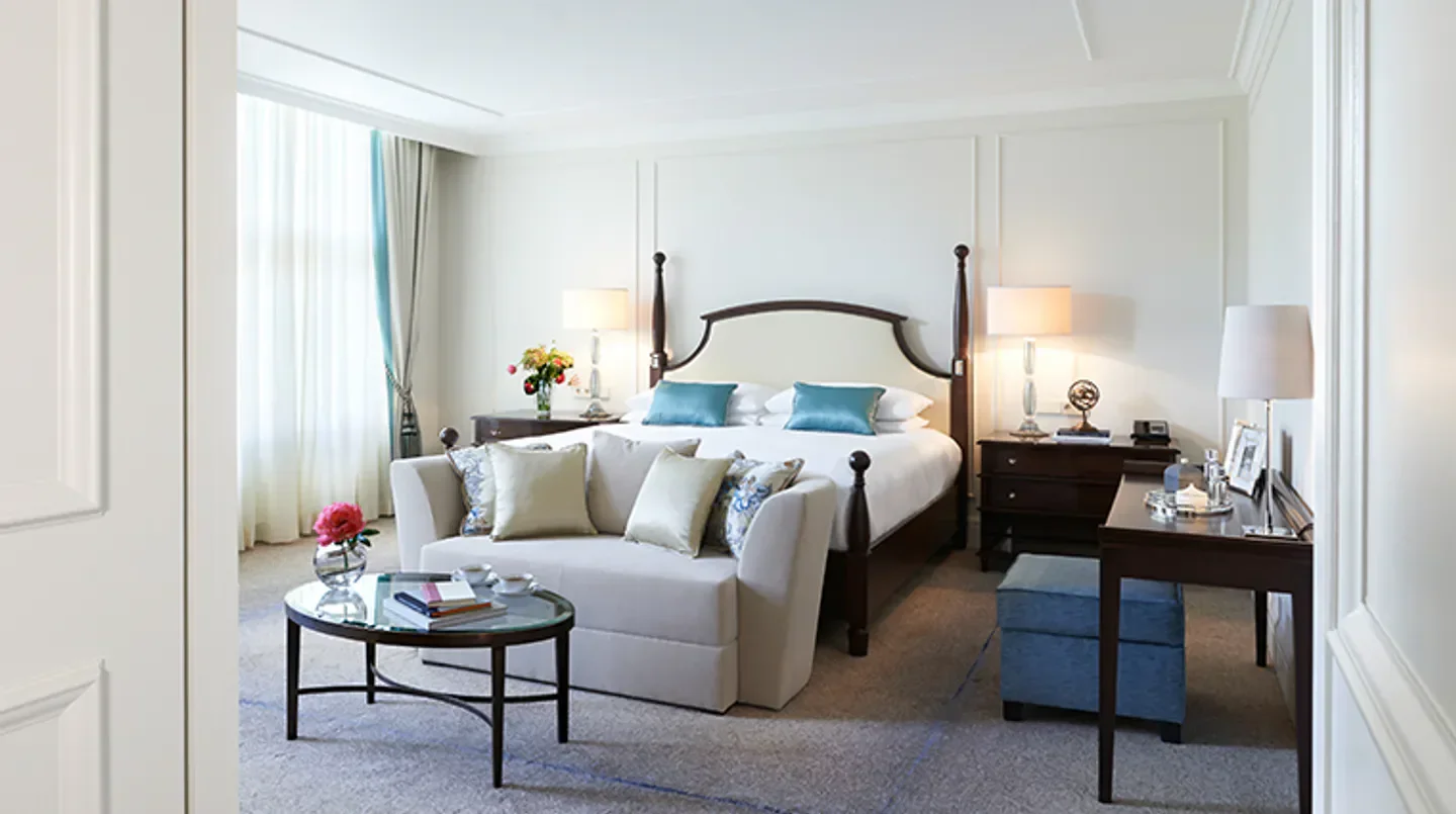 Elegant hotel room at Waldorf Astoria Amsterdam, featuring a luxurious bed in Amsterdam.