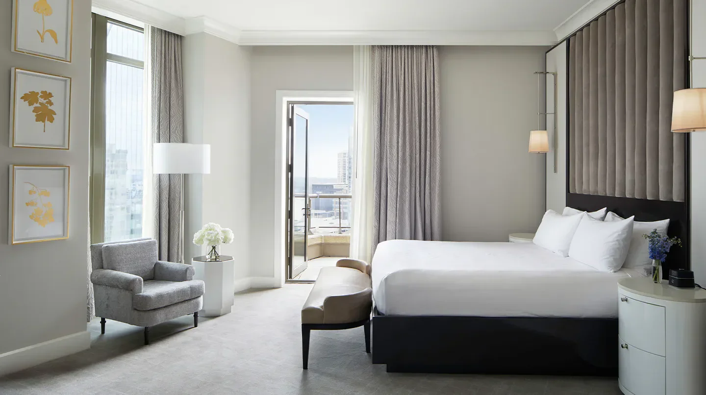Elegant bedroom at the Waldorf Astoria Atlanta Buckhead, with city view in Atlanta.