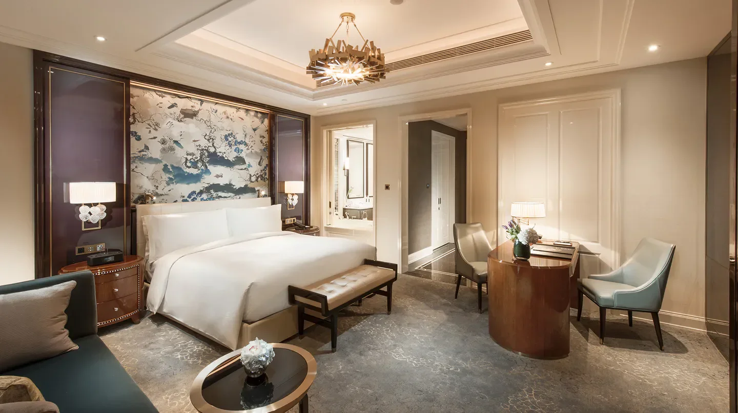 Luxury bedroom at Waldorf Astoria Chengdu, featuring elegant decor and artwork in Chengdu.