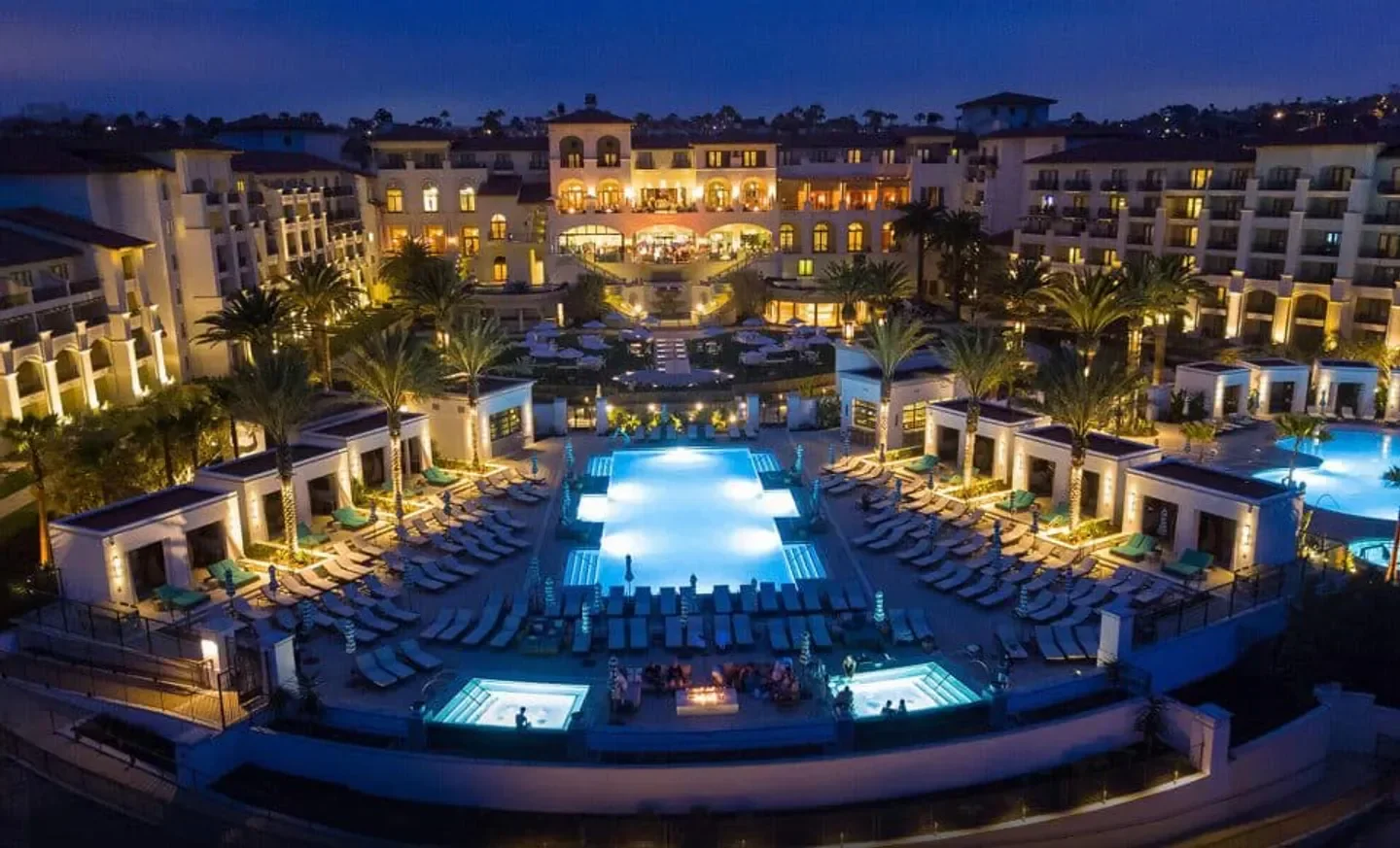 Waldorf Astoria Monarch Beach Resort & Club in San Diego, illuminated pool at night.
