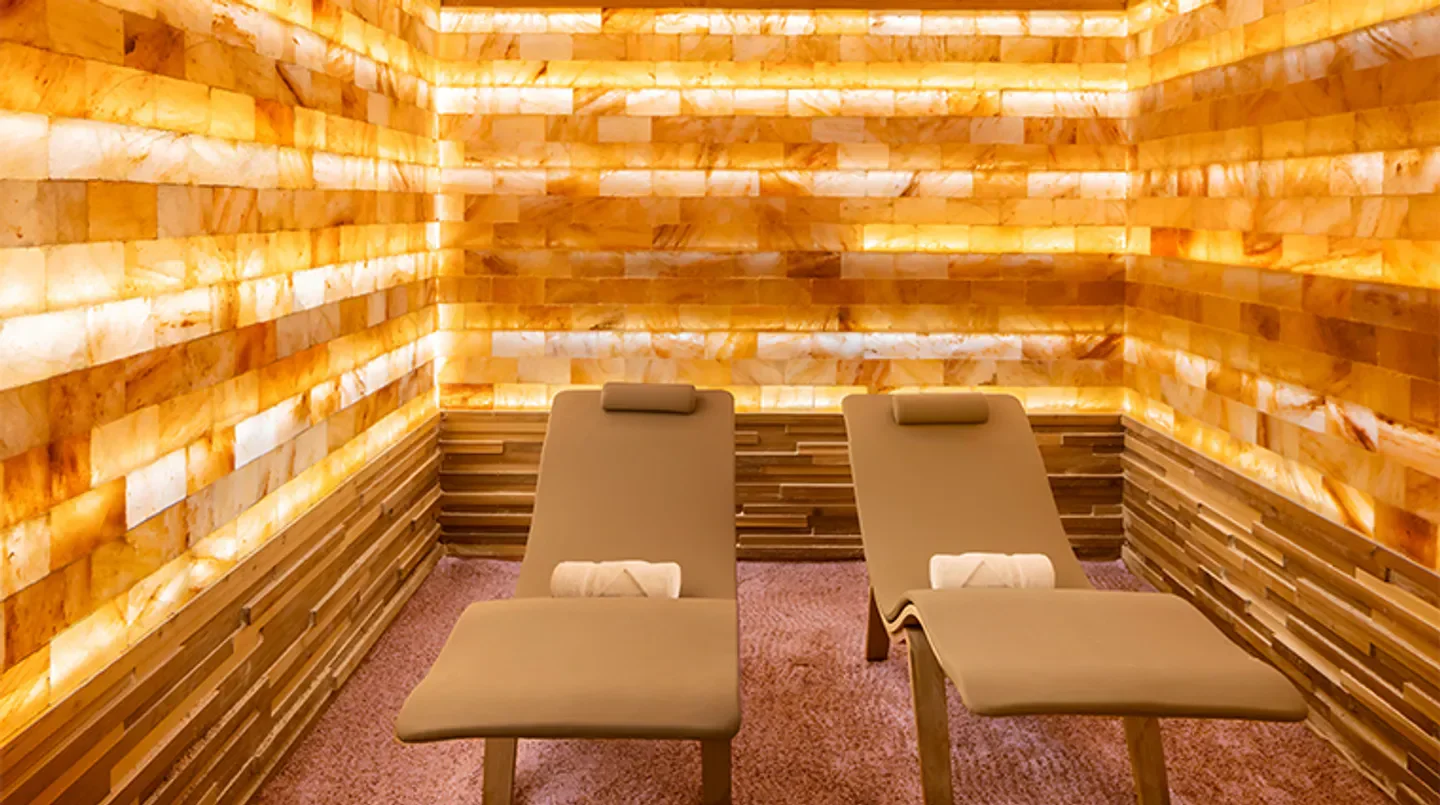 Relaxation lounge at the Waldorf Astoria Spa Orlando, featuring salt-brick walls in Orlando