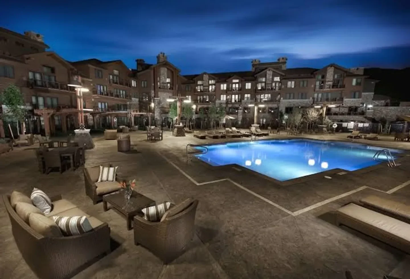 Waldorf Astoria Spa Park City pool and patio at dusk in Park City, Utah