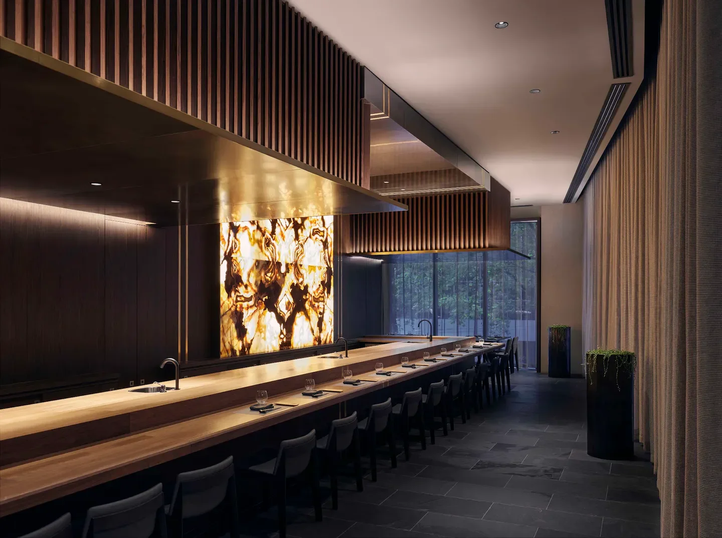 Interior of Warabi restaurant in Melbourne, featuring a long wooden counter and decor.