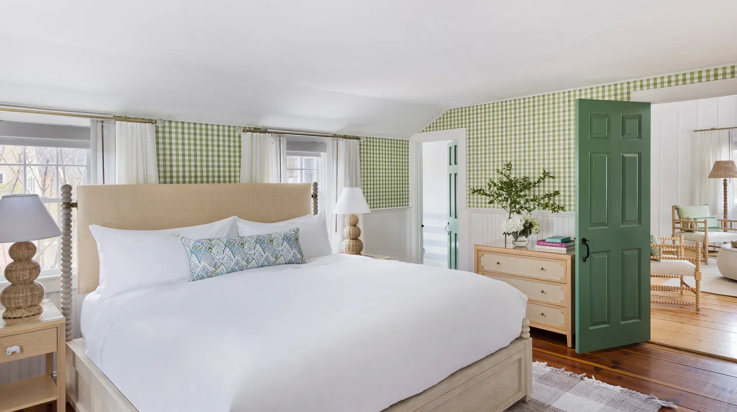 Cozy bedroom at the White Elephant Harborside Hotel in Nantucket, with a welcoming design.