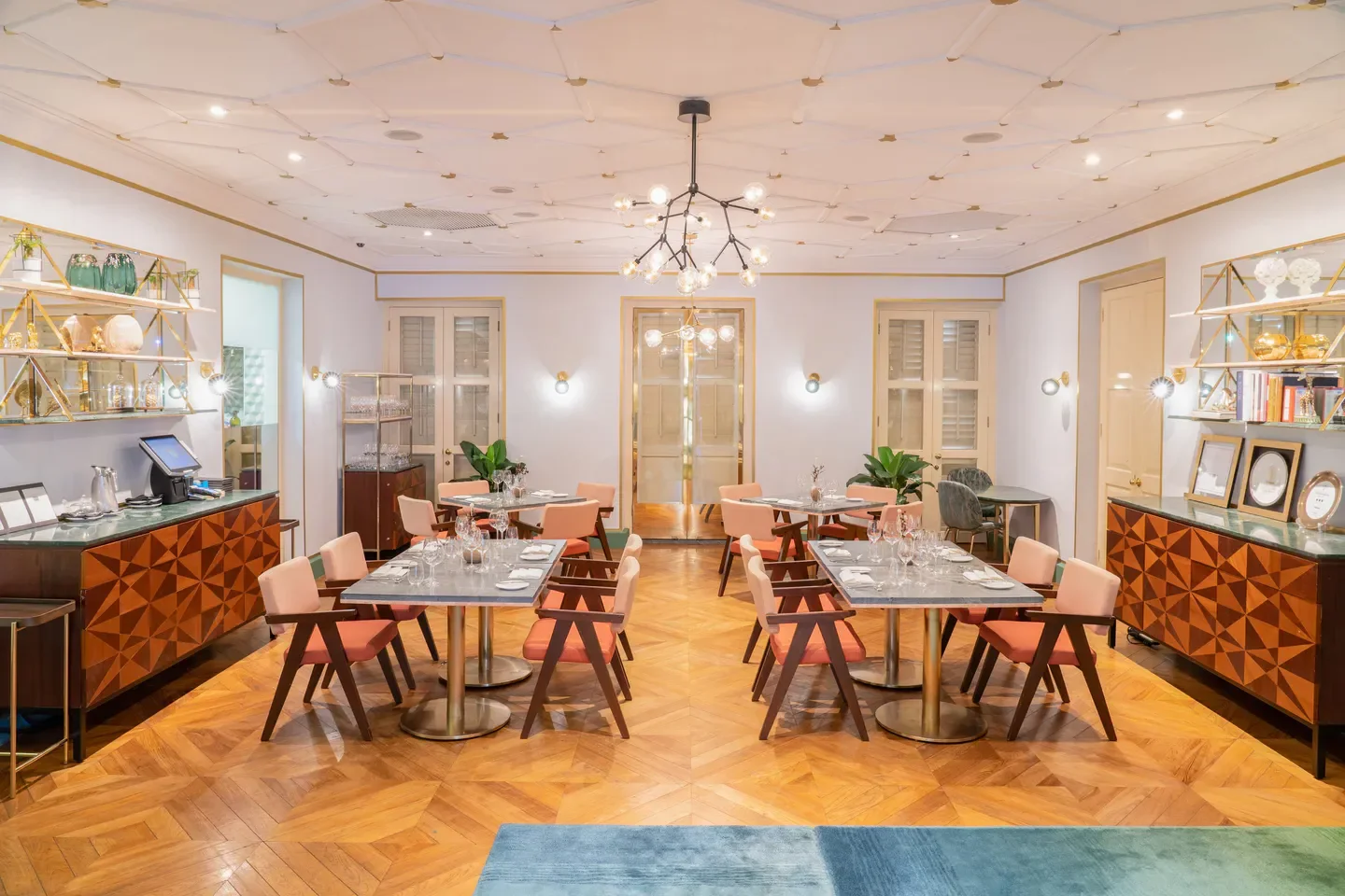 Elegant interior of Whitegrass restaurant in Singapore, featuring stylish decor and dining tables.