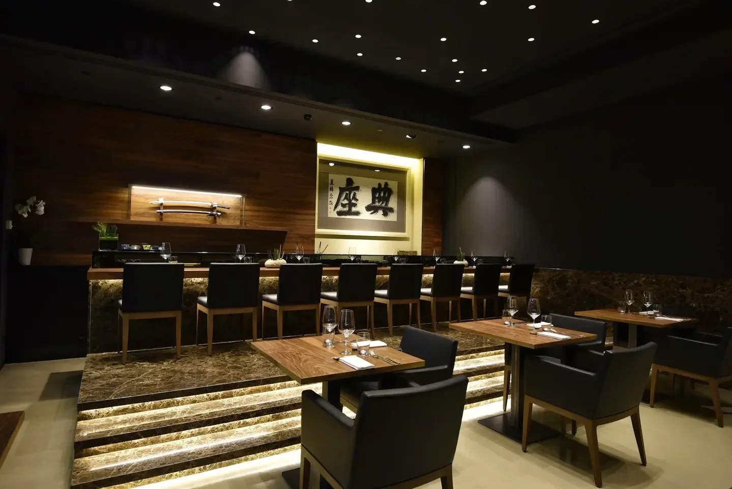 Elegant interior of Wicky's Innovative Japanese Cuisine in Milan, featuring sushi bar and seating.