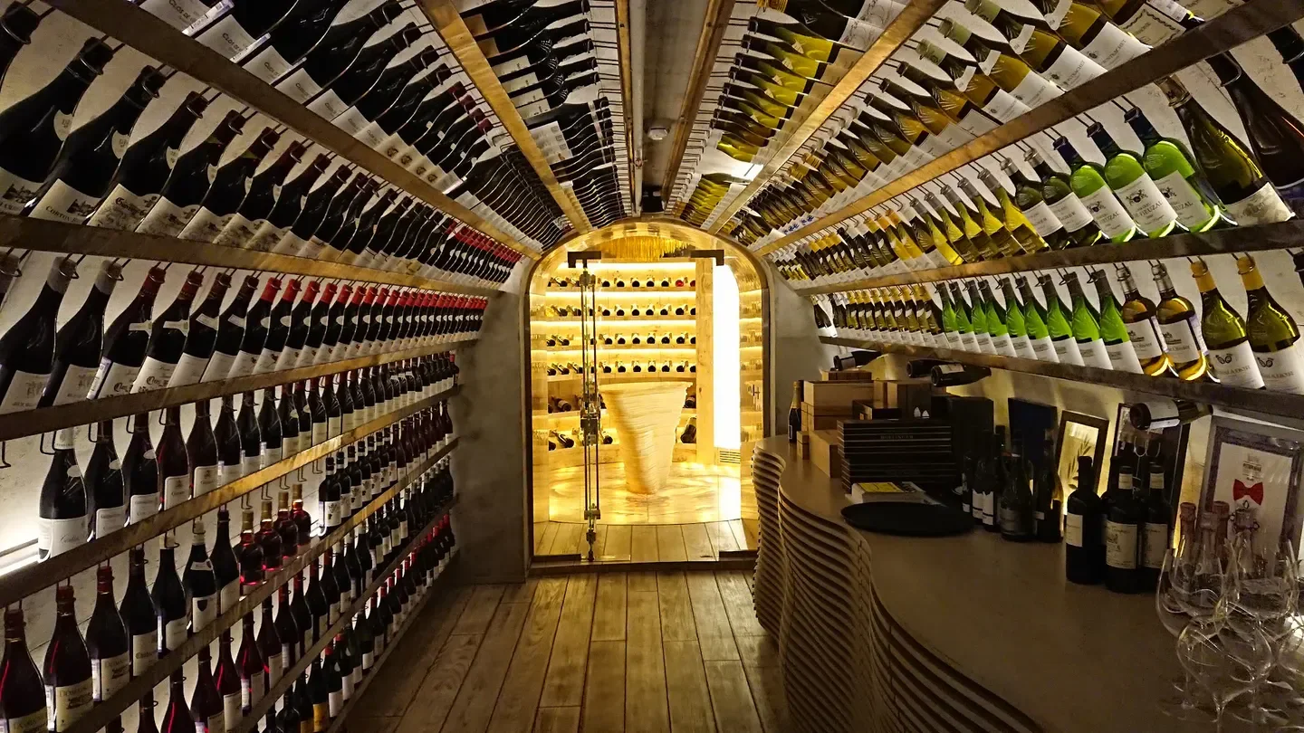 Wine cellar at Wine and Crab Nikolskaya Street, Moscow, featuring wine bottles and elegant interior