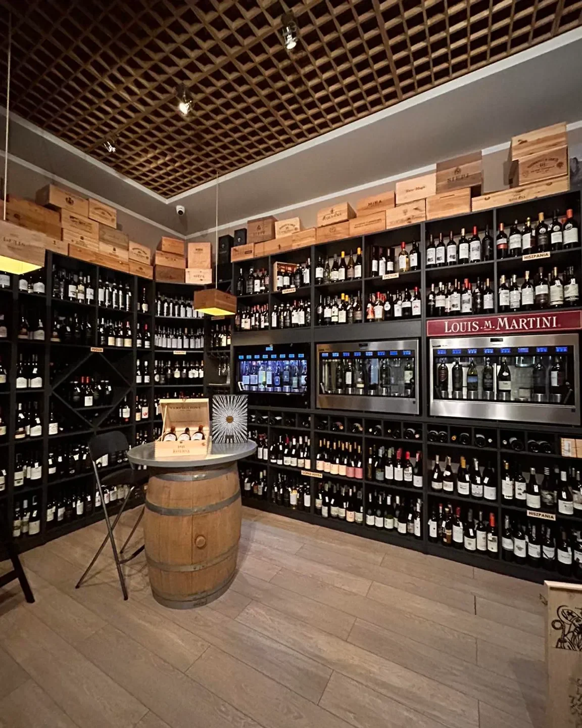 Interior of Wine Bar and Shop Stoccaggio in Krakow, showcasing shelves of wine bottles.