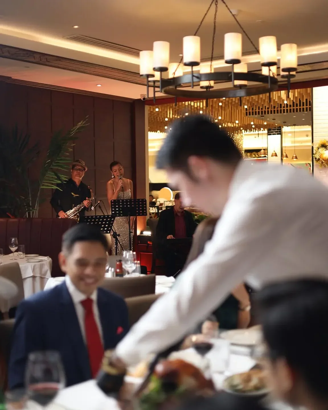 Live music at Wolfgang's Steakhouse Grill Manila, creating a vibrant dining experience.