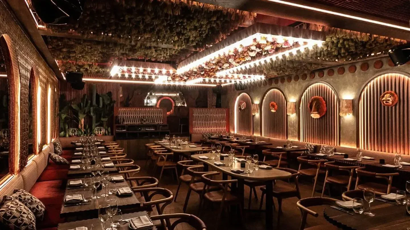 Interior of Yacatan restaurant in Paris, featuring elegant dining tables and decor.
