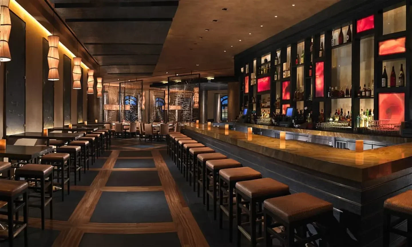 Interior of Yellowtail restaurant in Las Vegas, with bar seating and ambient lighting.