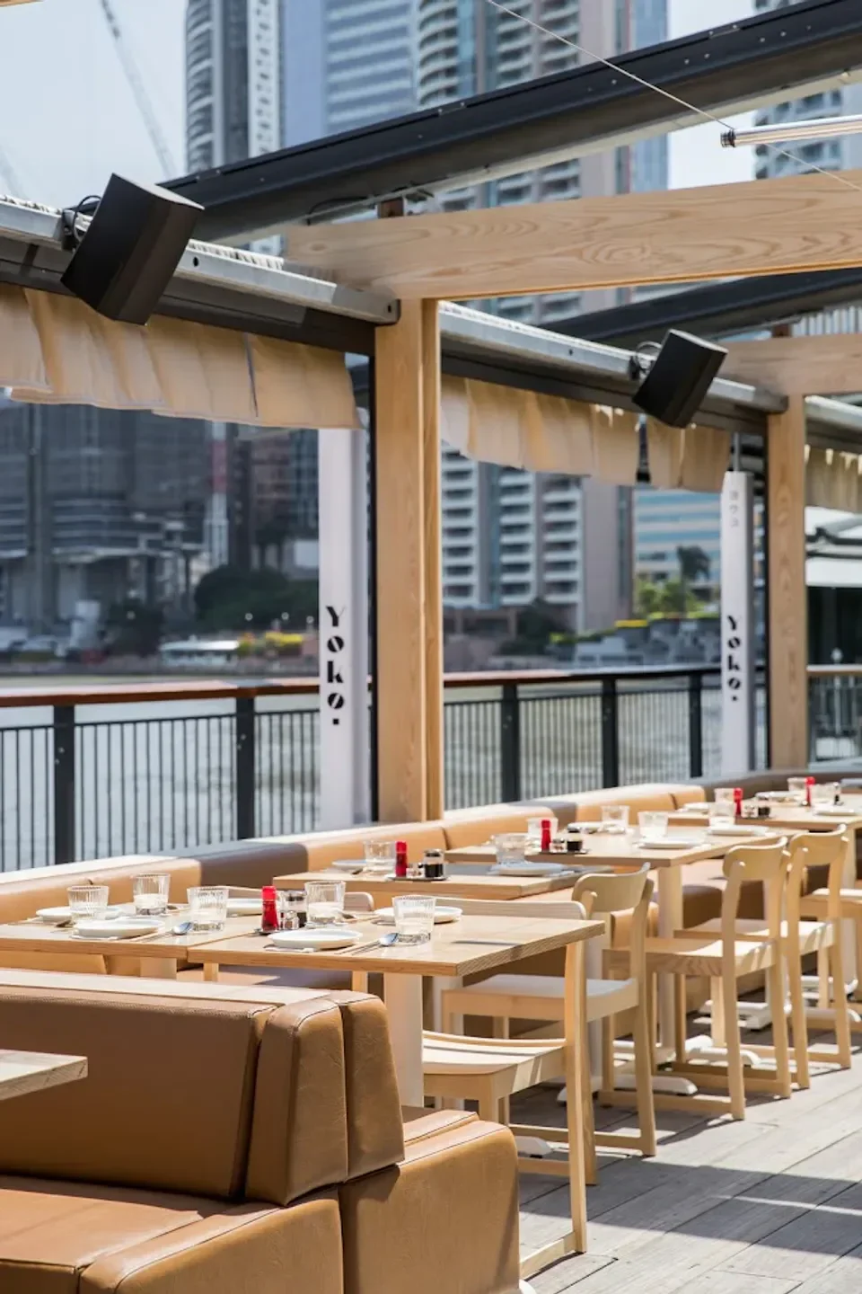 Outdoor seating at Yoko Dining in Brisbane, featuring tables set for service.