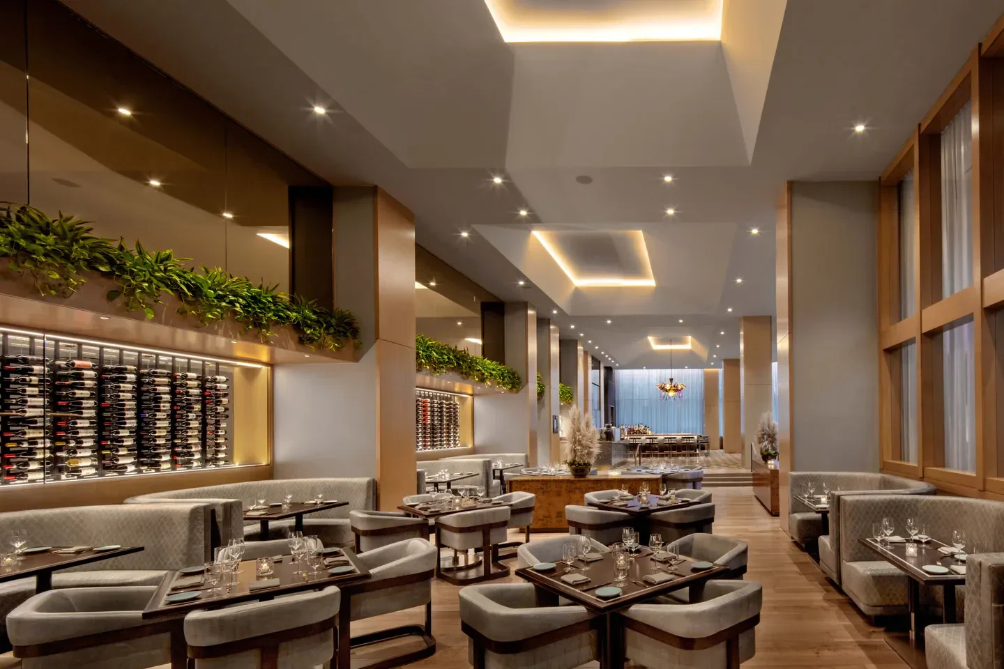 Elegant interior of Yolan restaurant in Nashville with wine display and dining tables