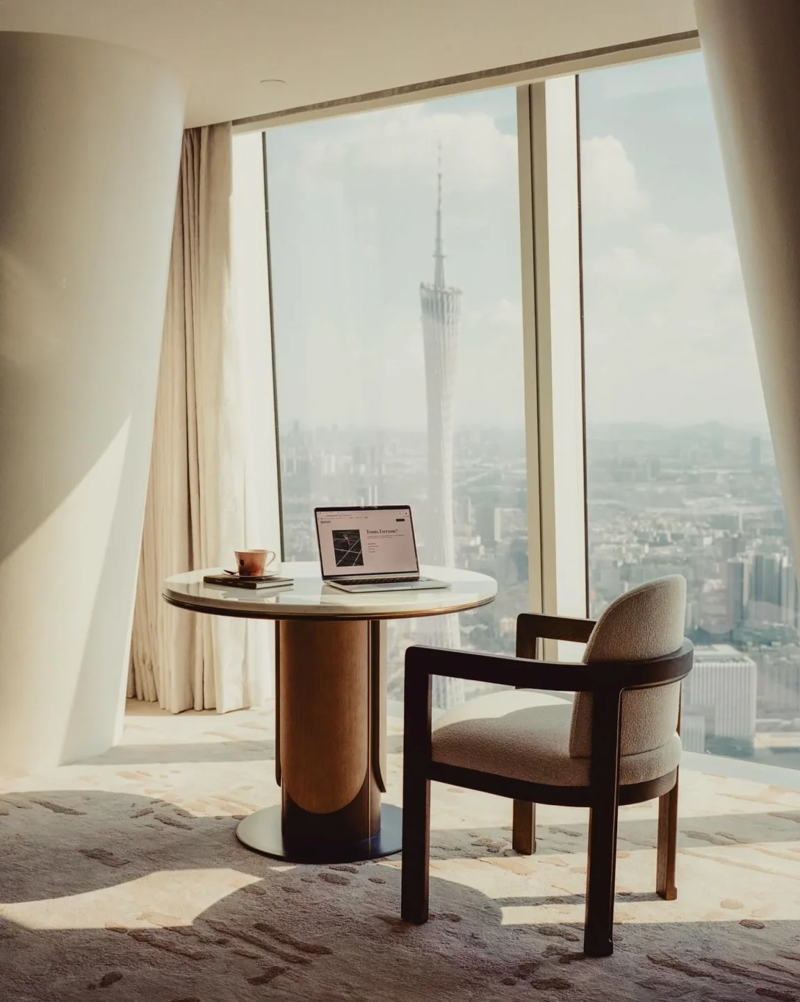 Interior view from Yu Yue Heen in Guangzhou with a city view, table and chair setting