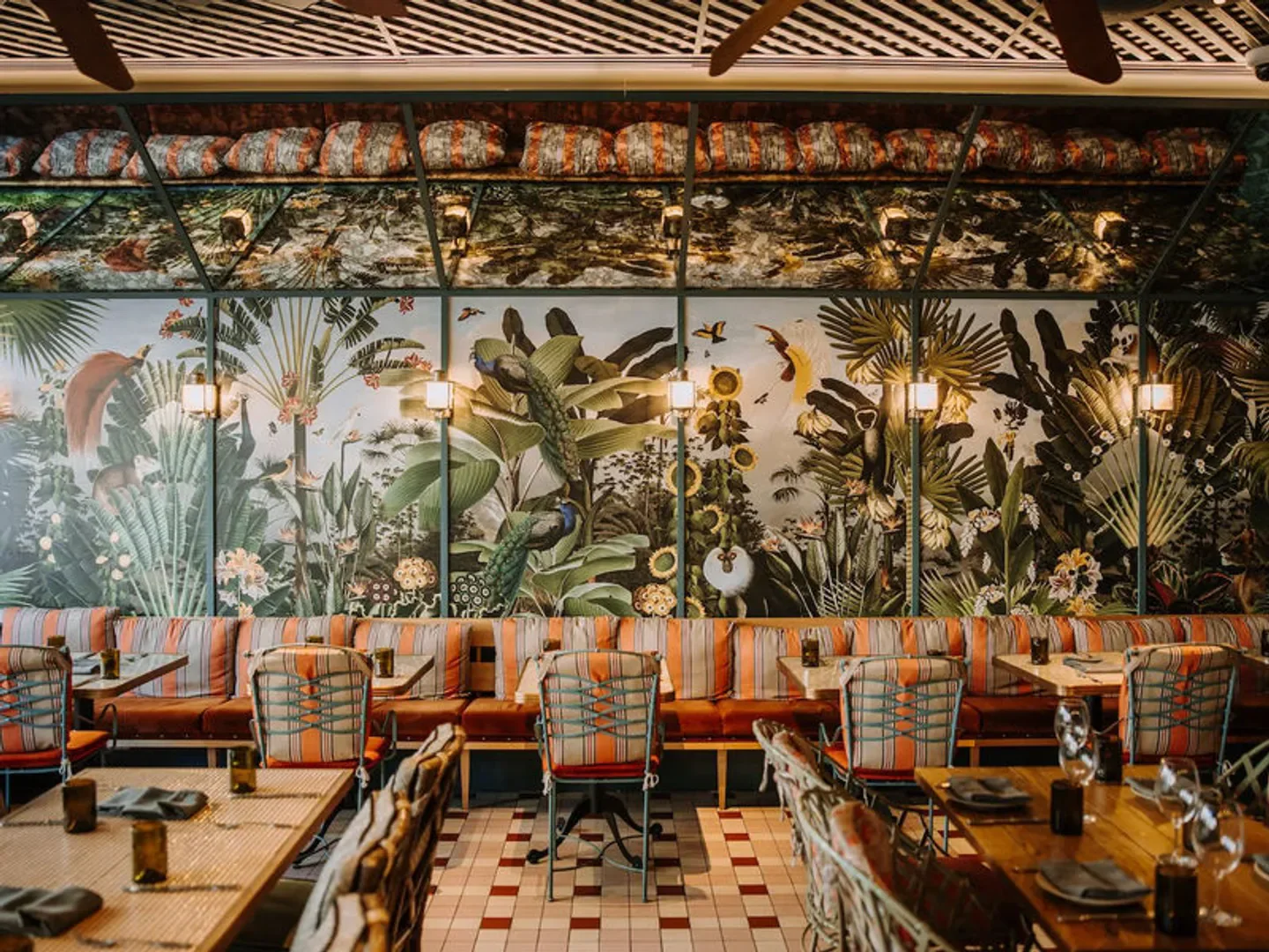 ZA ZA TA Bar and Kitchen in Brisbane: Stylish restaurant interior with tropical mural and seating.