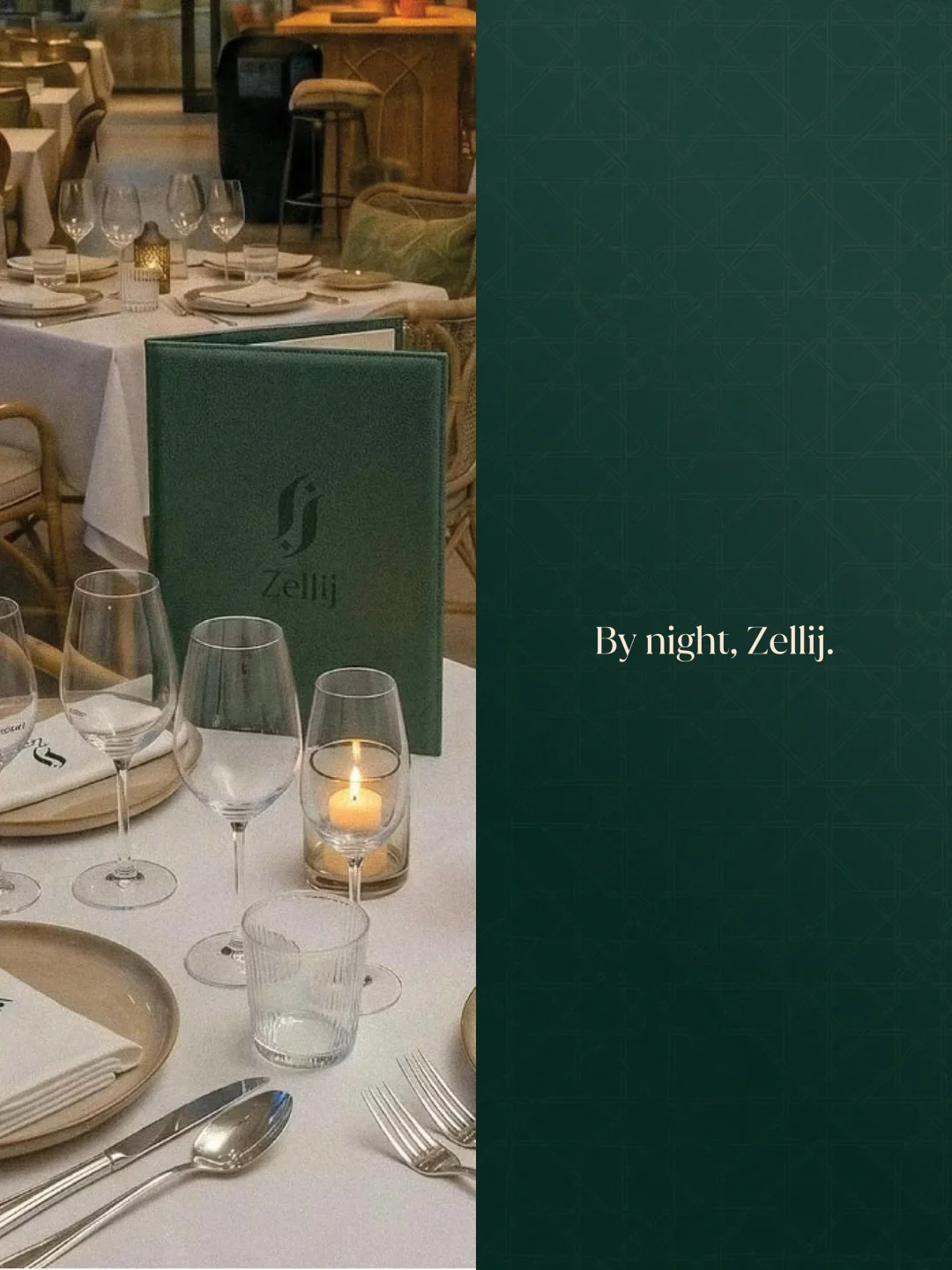 Elegant table setting at Zellij restaurant in the city, featuring wine glasses and a lit candle.