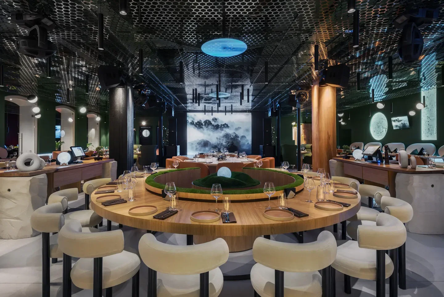 Stylish interior of Zemlya Moscow restaurant in Moscow, with round table setting.