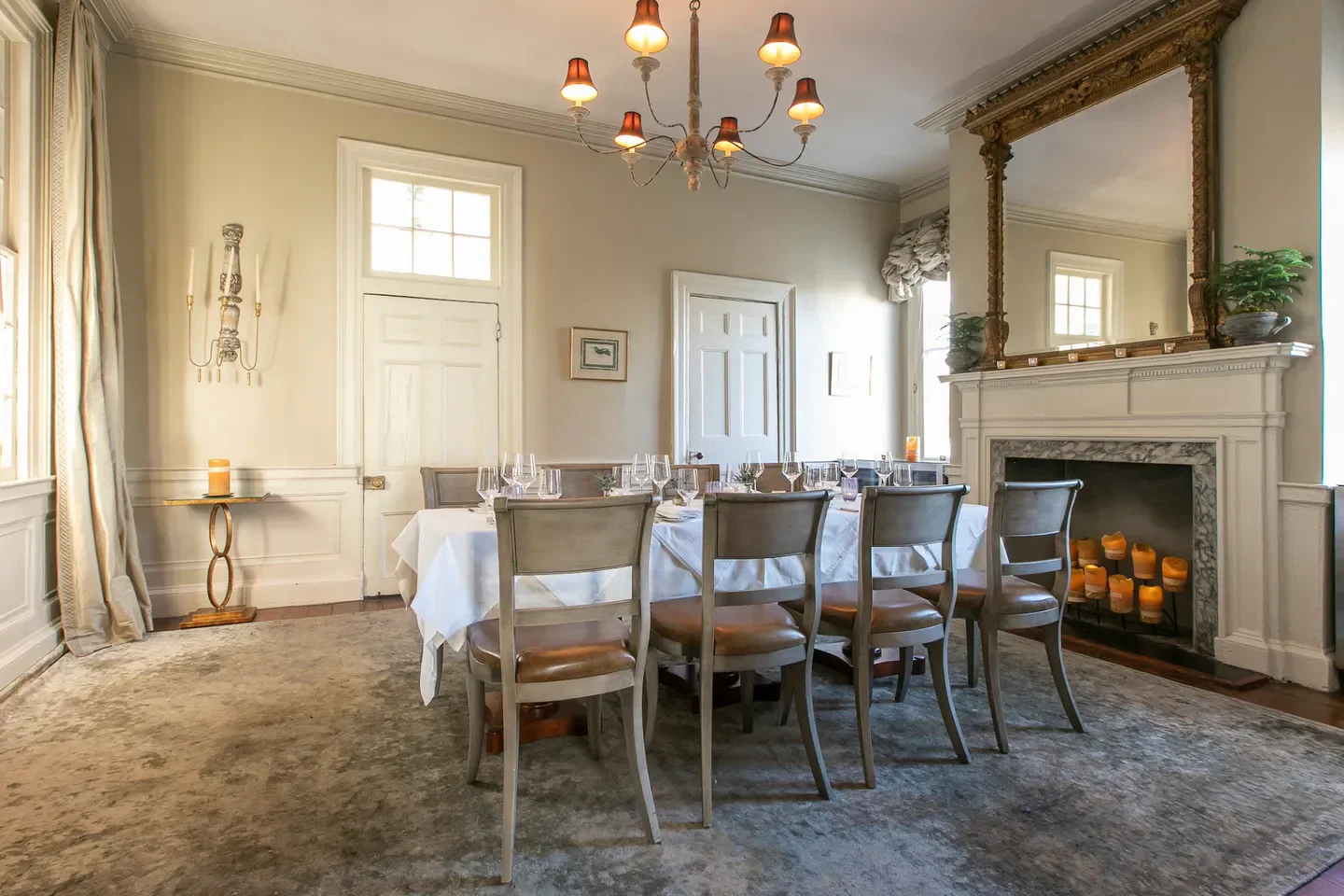 Elegant dining room at Zero Restaurant Bar in Charleston, featuring a fireplace
